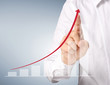 Business man pushing  graph