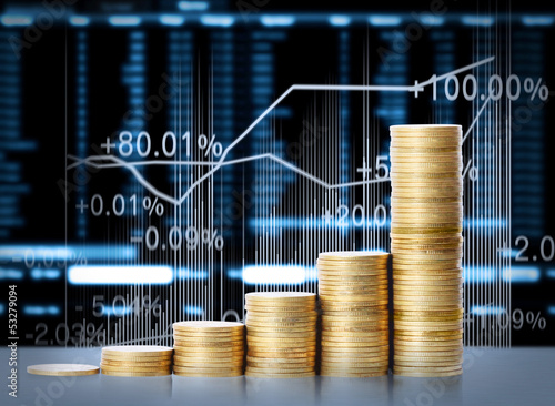 Photo: gold coins and graph them gold coins and graph them