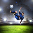 Photo: football player striking the ball football player striking the ball