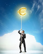 Image of businessman climbing rope