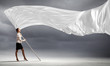Businesswoman holding white flag