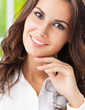 Photo: Portrait of thinking cheerful businesswoman Portrait of thinking cheerful businesswoman