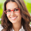 Photo: Young happy smiling businesswoman at office Young happy smiling businesswoman at office