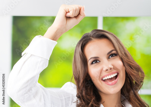 Photo: Happy gesturing smiling young businesswoman Happy gesturing smiling young businesswoman