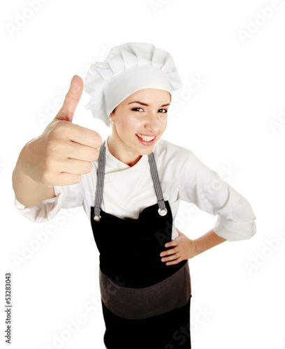 Photo: Attractive cook woman showing ok over white background Attractive cook woman showing ok over white background