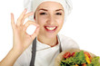 Attractive cook woman showing ok over white background
