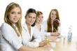 Photo: Female Pupils Studying At Desk Female Pupils Studying At Desk