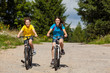 Healthy lifestyle - teenage girl and boy biking