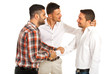 Two executives congratulate their colleague