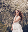 Portrait of a beautiful girl with curly red hair
