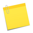 Yellow sticky note clipped with a paperclip