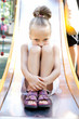 Foto: Little girl playing on a playground Little girl playing on a playground