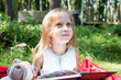 Foto: Funny little girl in a park Funny little girl in a park