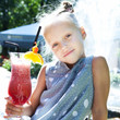 Foto: Little girl with fruit cocktail Little girl with fruit cocktail