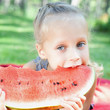 Foto: Funny child eating watermelon Funny child eating watermelon