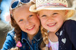 Two girls smiling together.