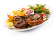 Photo: Grilled steaks, baked potatoes and vegetables Grilled steaks, baked potatoes and vegetables