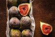Figs in the box on wooden table