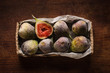 Figs in the box on wooden table