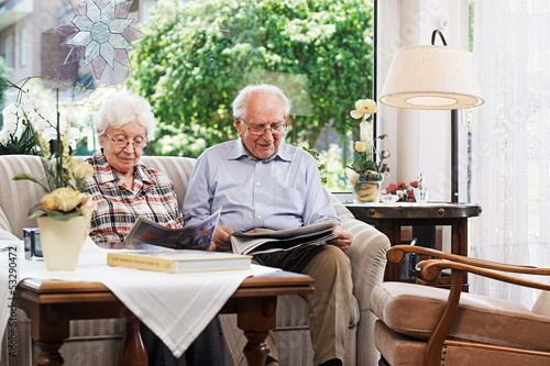 Photo: Senior couple reading the newspaper Senior couple reading the newspaper