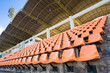 Stadium Orange Chair with roof and blue sky