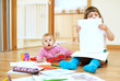 Photo: Two children playing with paper Two children playing with paper
