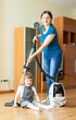 mother and daughter are doing house cleaning