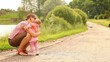 Baby first steps. baby goes to the mother.