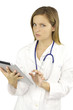 Beautiful female doctor working with tablet