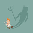 Businessman casting a devil shadow