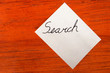 Search - Post it Note on Wood Background