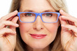 Photo: Beautiful senior woman wearing eyeglasses. Beautiful senior woman wearing eyeglasses.