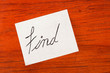 Find - Post it Note on Wood Background