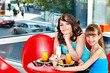 Photo: Mother and daughter in restaurant. Mother and daughter in restaurant.
