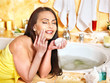 Woman relaxing at home bath.