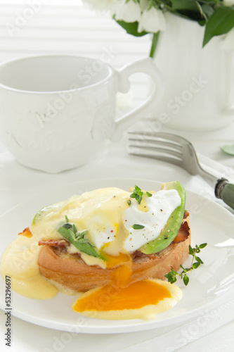 Photo: Breakfast. Poached egg with hollandaise sauce, Breakfast. Poached egg with hollandaise sauce,