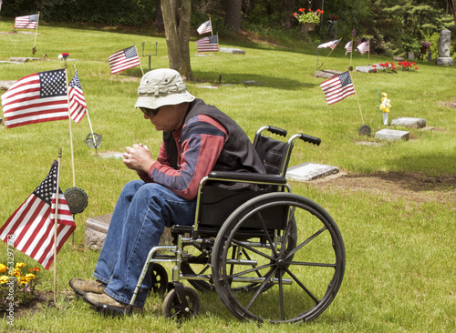 Photo: disabled man at the cemetery disabled man at the cemetery