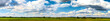 Wind power plants on field panorama