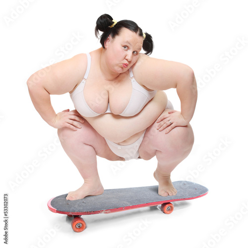 Photo: Funny overweight woman skateboarding. Funny overweight woman skateboarding.