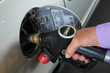 Pumping gas at a gas station