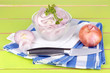 Onion cut with rings in bowl on wooden table close-up