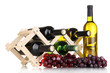 Bottles of wine placed on wooden stand isolated on white