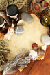 Composition with old papers, herbs, stones and bottles with