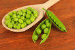Sweet green peas on wooden background