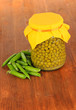 Green peas on wooden background