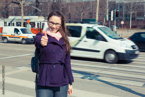 Photo: Young Business Woman next to Urban Road Young Business Woman next to Urban Road