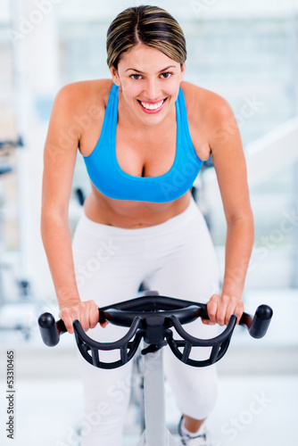 Photo: Woman working out at the gym Woman working out at the gym