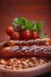 plate of baked beans and sausage