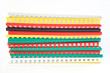 Stack of books with colorful plastic spine isolated on white