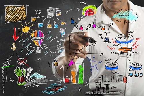 Photo: Businessman drawing a new project Businessman drawing a new project